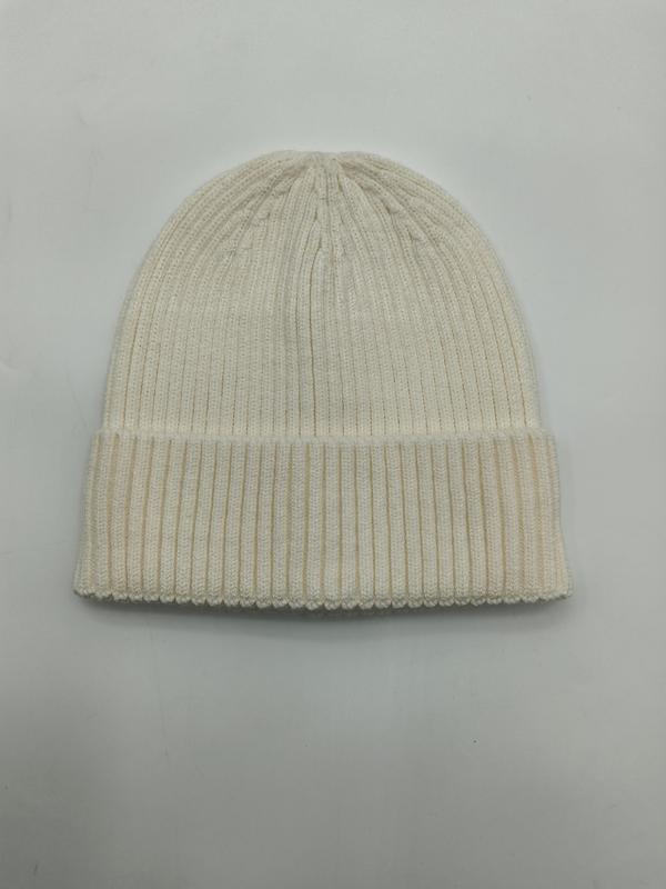 Cream off-white ribbed knit cuffed beanie hat laid flat on white background, showing fine rib texture and folded brim - wholesale price for USA buyers