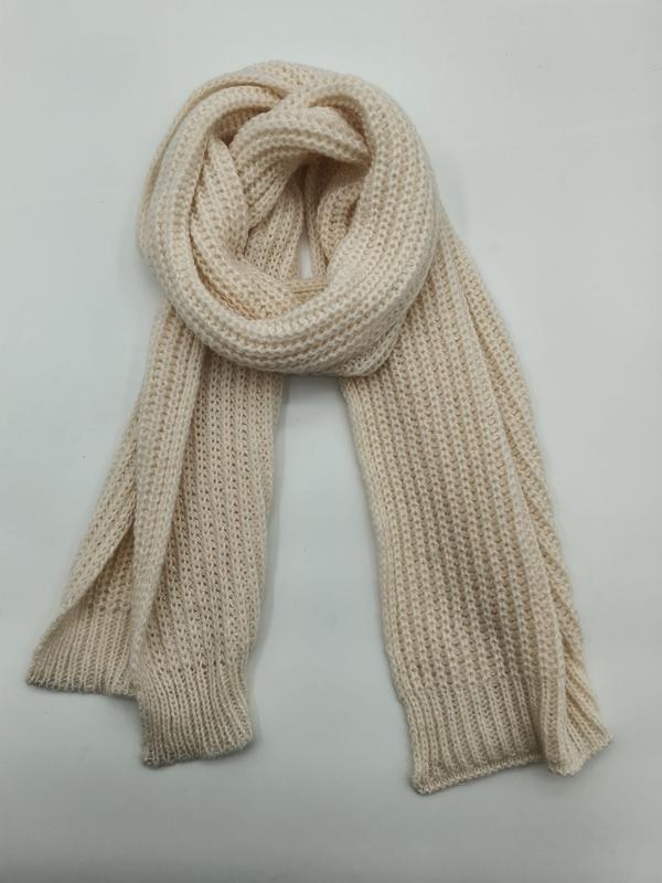 Cream chunky ribbed knit scarf looped and draped flat on white background, showing texture detail - no MOQ for stock designs