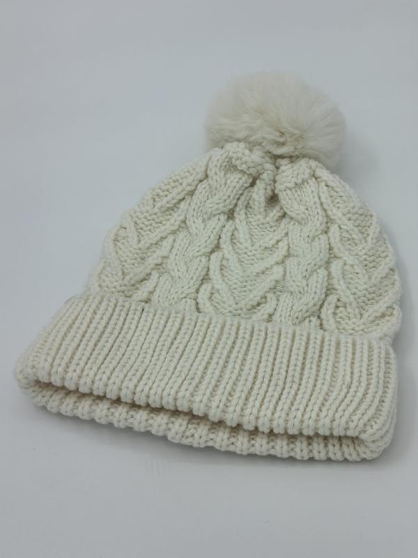 Cream white cable knit winter beanie hat with fluffy pom pom on top and double ribbed fold-up cuff - hotel amenity scarf supplier