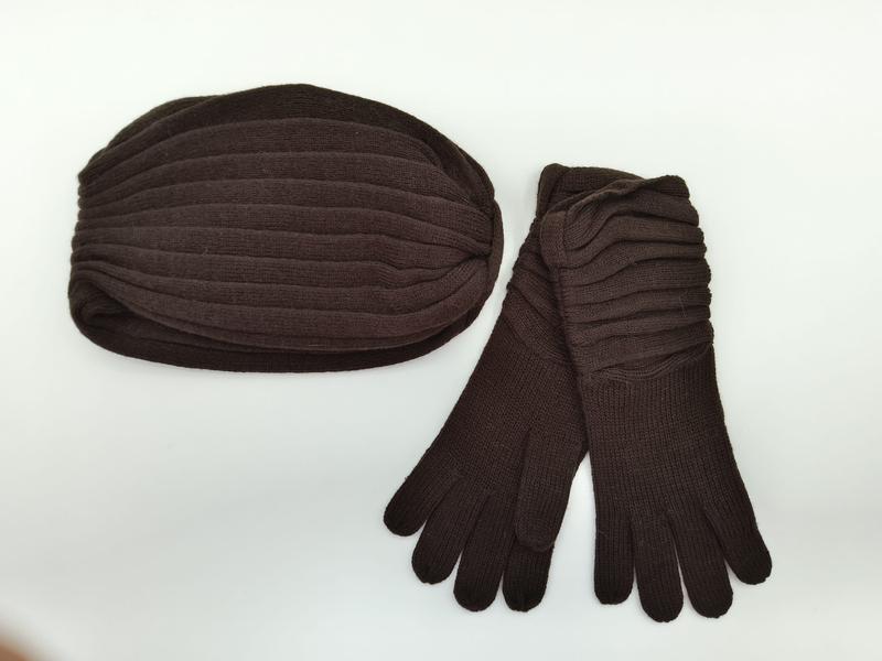 Dark brown ribbed knit winter hat and matching long gloves set laid flat on white background - wholesale price for Middle East buyers