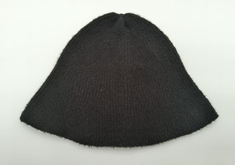 Dark charcoal ribbed knit wool beanie hat laid flat on white background showing textured rib pattern - no MOQ for stock designs