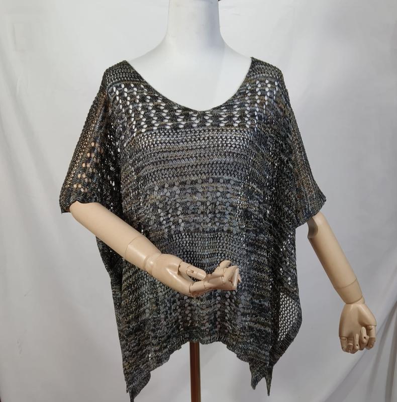 Dark multicolor open knit crochet poncho top with short sleeves and asymmetric hem displayed on mannequin - email us get price list now