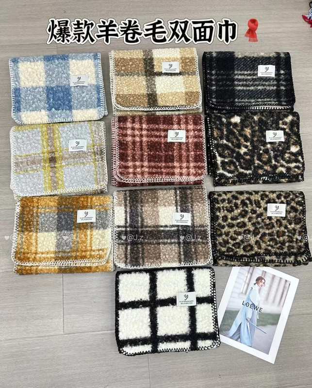 Collection of 10 double-sided boucle wool face towels in plaid, leopard, and check patterns displayed flat on floor - custom packaging design free