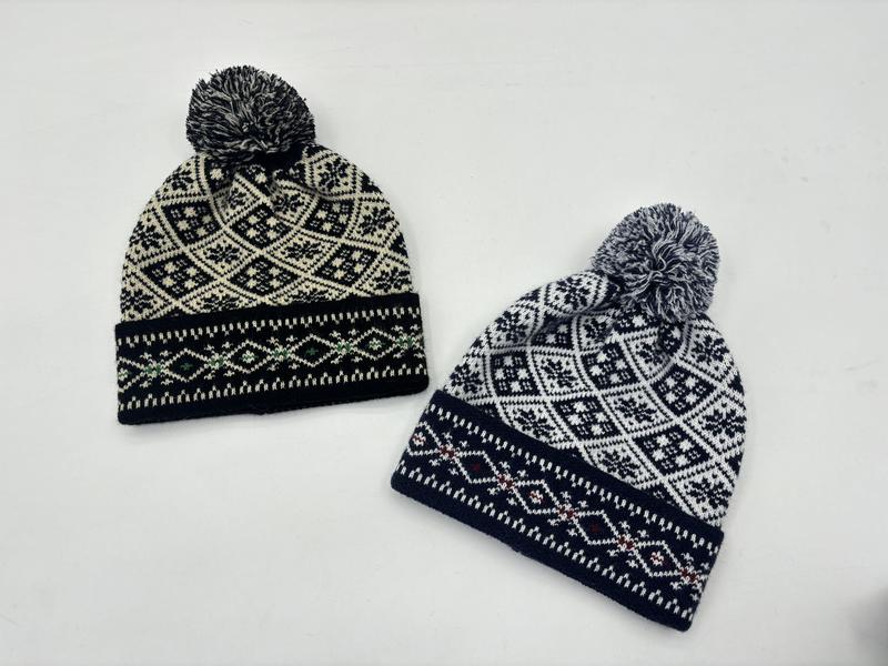 Two Fair Isle knit pom pom beanies in black-cream and navy-white Nordic snowflake pattern on white background - MOQ 100pcs mixed colors OK