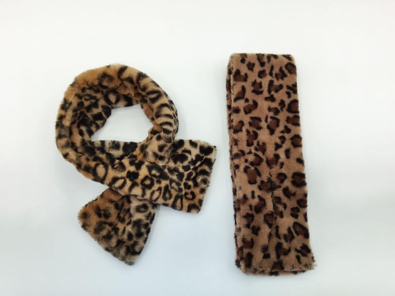 Faux fur leopard print scarf tied in a knot and matching rectangular headband on white background - tiered pricing available ask quote