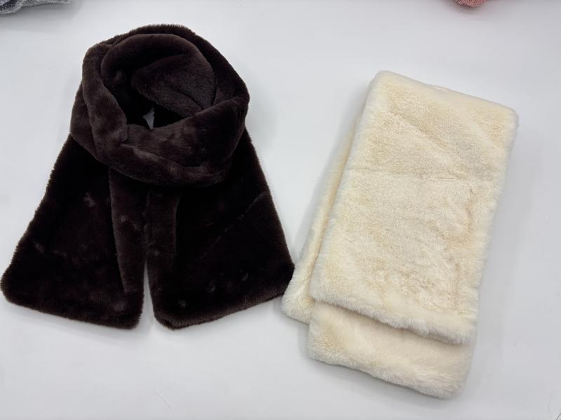Two faux fur plush scarves side by side, one dark chocolate brown draped and one cream white folded, soft fluffy texture - BSCI + Oeko-Tex + GRS certified