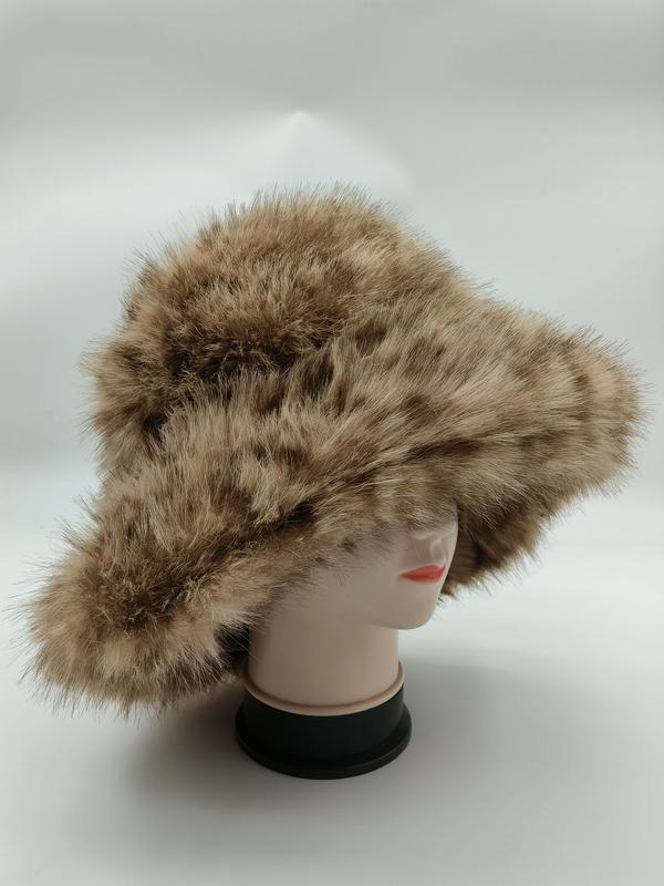 Tan and brown spotted faux fur wide brim bucket hat displayed on a white mannequin head against a light background - free sample within 7 days