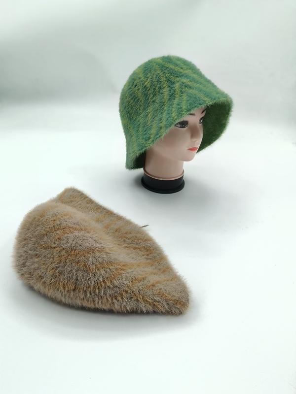 Green striped fuzzy knit bucket hat on mannequin head with matching tan beige flat folded hat on white surface - wholesale price for USA buyers