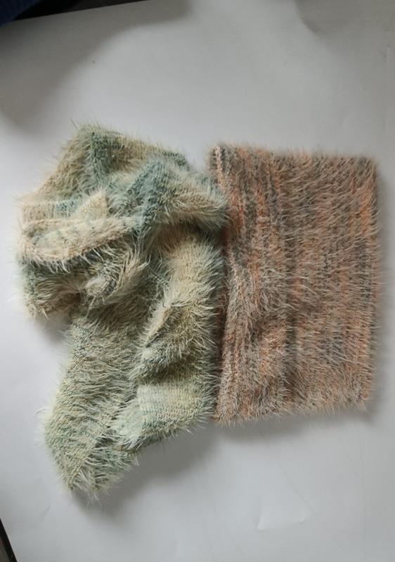 Two eyelash yarn knit fabric swatches in sage green and dusty rose peach tones laid on white surface - ODM OEM service available