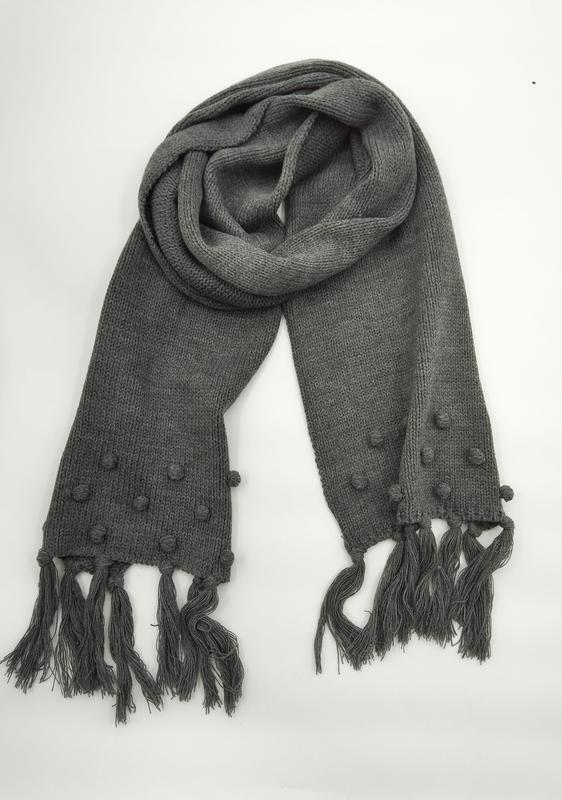 Gray chunky knit scarf with bobble texture detailing and long tassel fringe ends, coiled on white background - custom size no extra charge