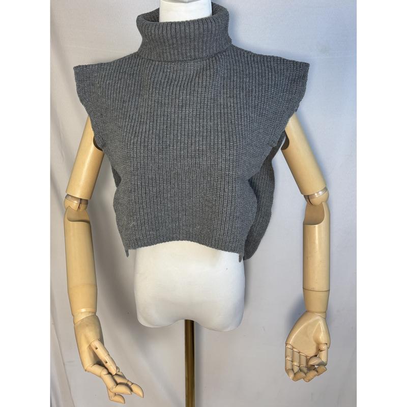 Gray ribbed knit cropped turtleneck sleeveless sweater vest displayed on a mannequin with wooden articulated arms - wholesale price for Middle East buyers