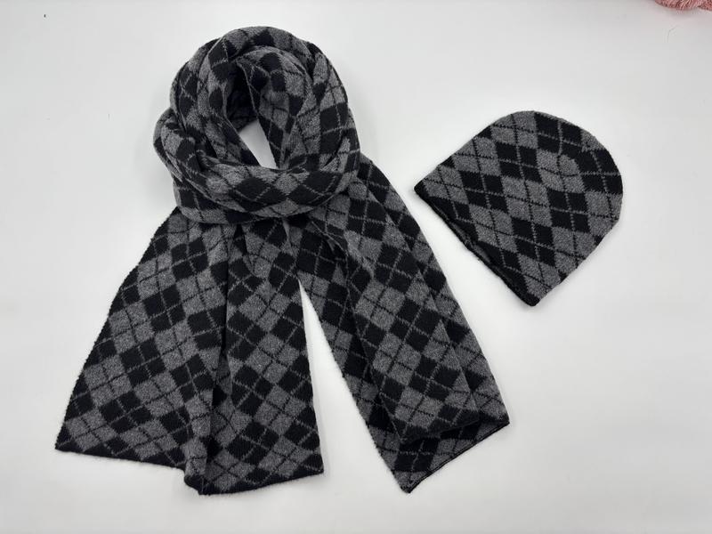 Grey and black argyle diamond pattern knit scarf and matching beanie hat set laid flat on white background - tiered pricing available ask quote