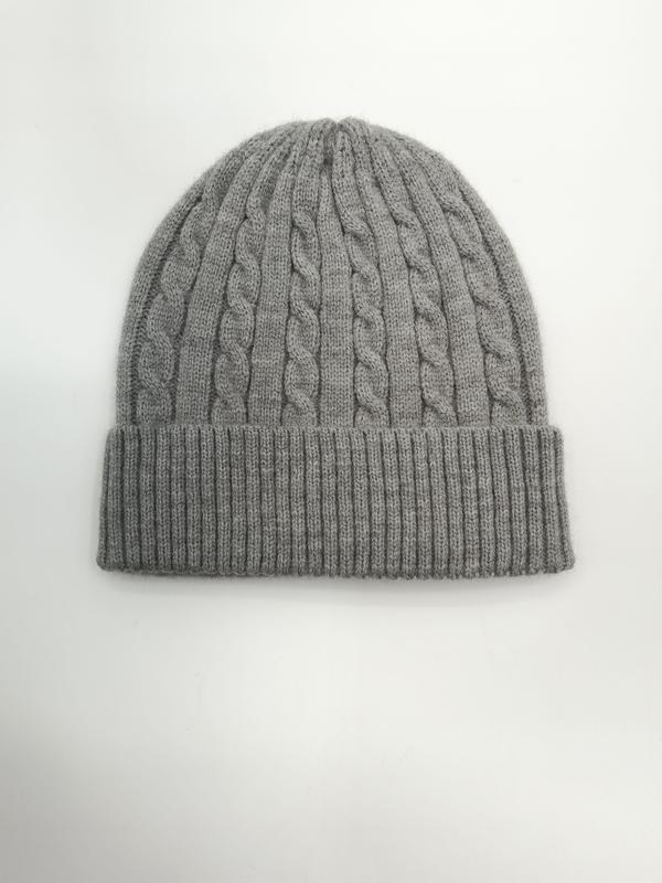 Light grey cable knit winter beanie hat with folded ribbed cuff, laid flat on white background - ISO 9001 quality controlled