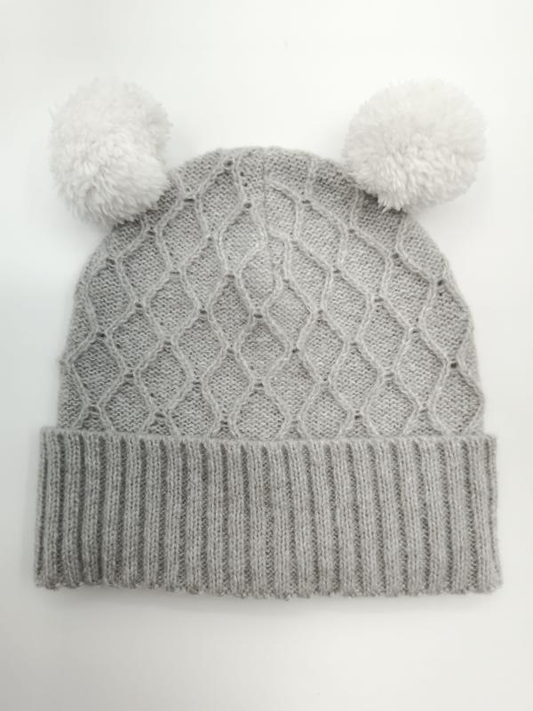 Grey cable knit winter beanie hat with two white fluffy pom poms on top, ribbed cuff, laid flat on white background - no MOQ for stock designs
