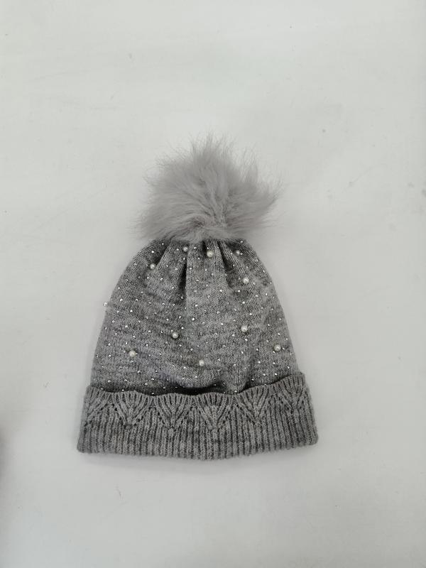 Grey knitted winter beanie hat with scattered pearl and rhinestone details, cable knit cuff, and fluffy faux fur pompom on top - Oeko-Tex Standard 100 certified