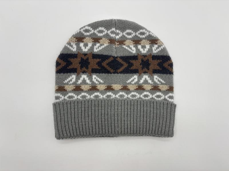 Grey knit beanie hat with Southwestern geometric pattern in brown, navy, cream, and white with ribbed cuff - free sample within 7 days