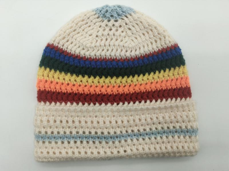 Handmade crochet beanie hat in cream with multicolor rainbow stripes including blue, green, yellow, orange and red bands - gift shop wholesale supplier