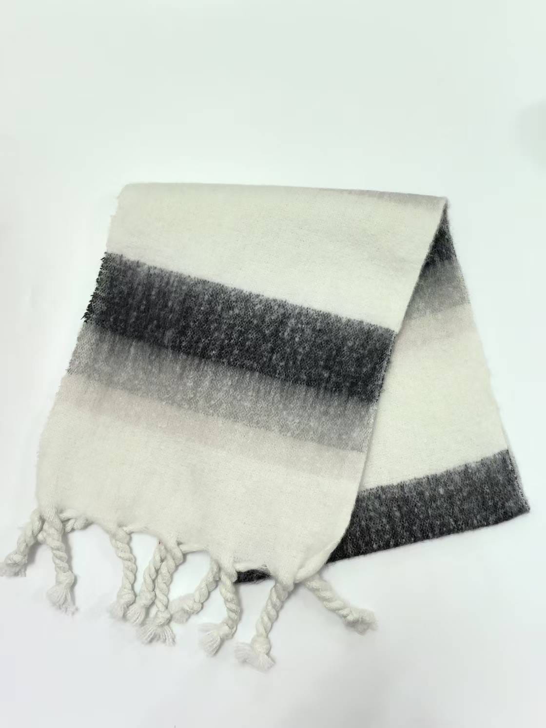 Folded ivory and charcoal gray striped brushed scarf with twisted rope fringe ends on white background - custom packaging design free
