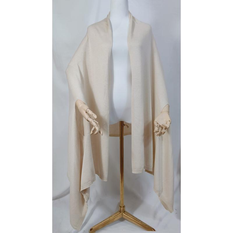 Cream ivory knit wrap shawl draped on mannequin with wooden hands and gold tripod stand, open front poncho style - corporate gift customization