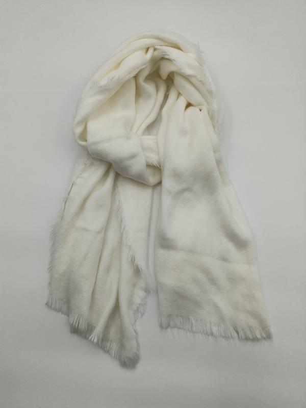 Ivory cream lightweight wrap scarf with fringe hem, loosely draped and knotted on white background - event merchandise supplier