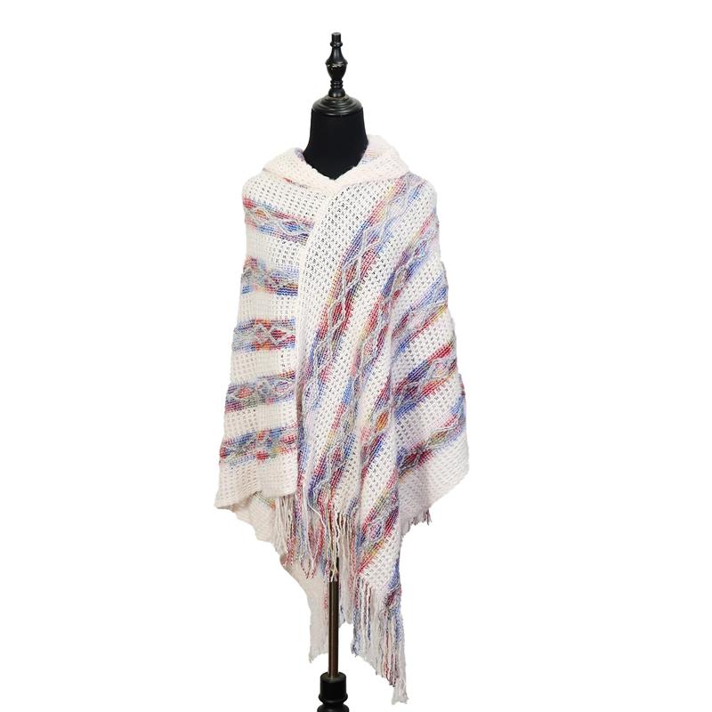 Ivory hooded knit poncho with multicolor red blue striped pattern and fringe hem displayed on black dress form mannequin - free sample within 7 days