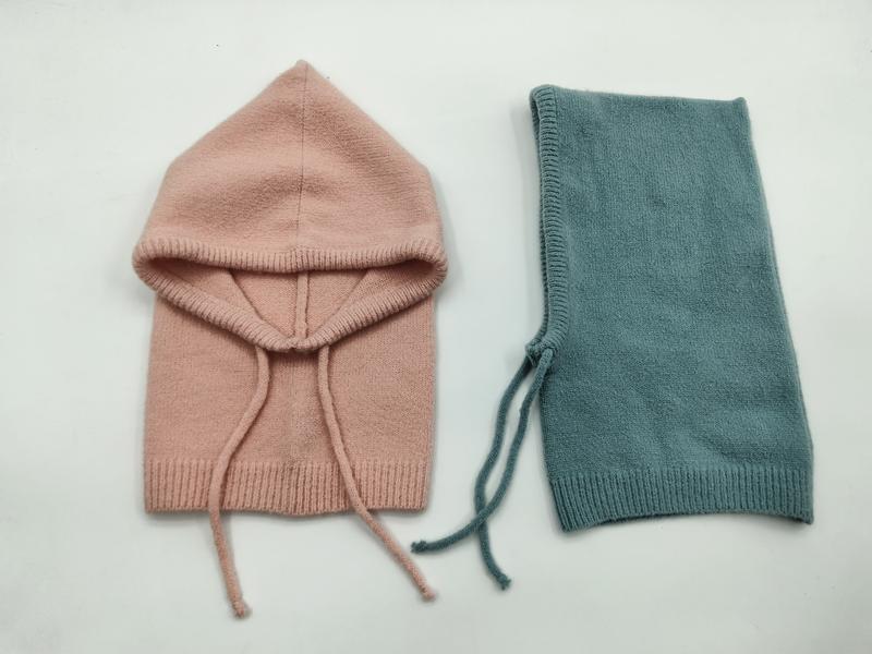 Two knit baby balaclavas laid flat, one blush pink with hood open and one folded teal, both with drawstring ties - ODM OEM service available - bulk order 20-day delivery
