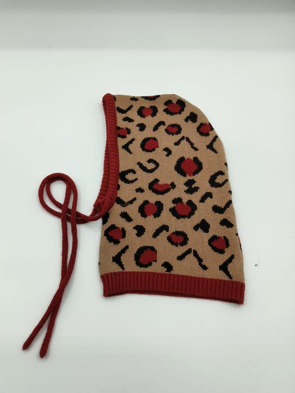 Knitted balaclava hood in beige with red and black leopard print pattern, red ribbed trim and adjustable tie strings - BSCI audit passed supplier