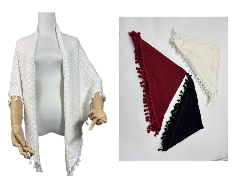 White diamond knit tassel shawl wrap on mannequin with burgundy, black, and white triangle folded shawls on right - gift shop wholesale supplier