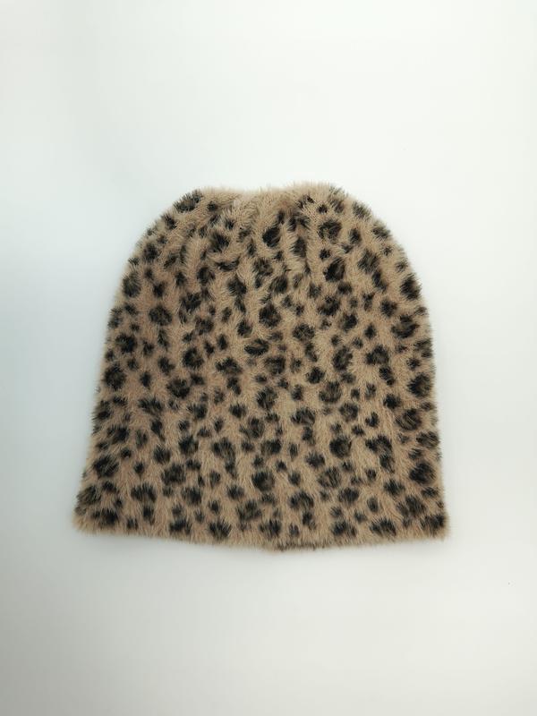 Flat lay of a tan and dark brown leopard print fuzzy knit beanie hat on a white background - custom Pantone color matching