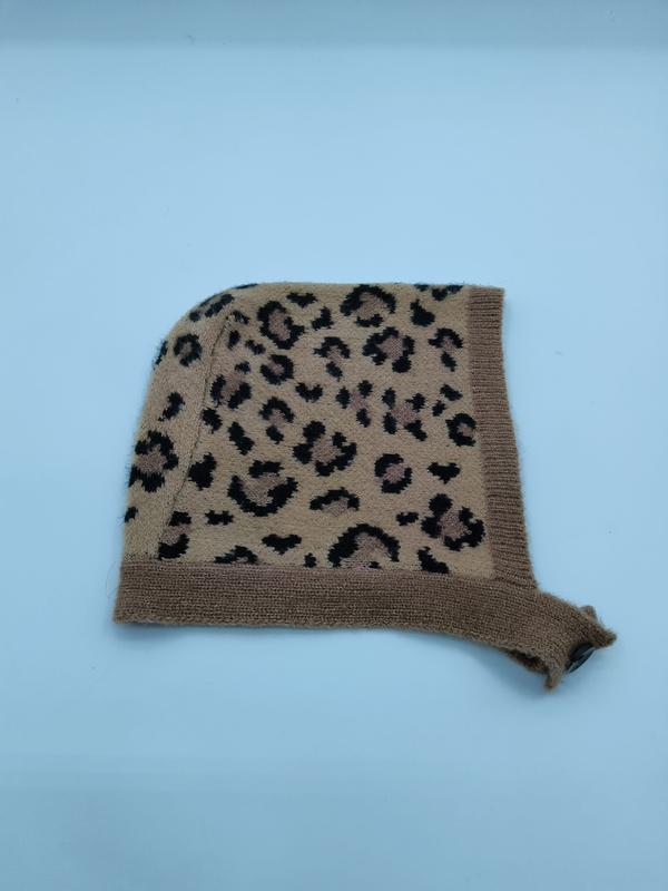 Camel brown leopard print knit baby bonnet hat with ribbed trim and tie, laid flat on white background - BSCI + Oeko-Tex + GRS certified