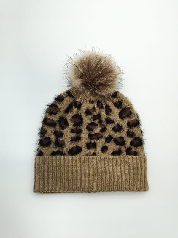 Camel brown leopard print knitted beanie hat with fluffy faux fur pom-pom on white background - ISO 9001 quality controlled