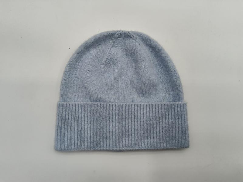 Light blue soft knit beanie hat with wide ribbed cuff, laid flat on white background, cashmere-style winter cap - express production 15 days