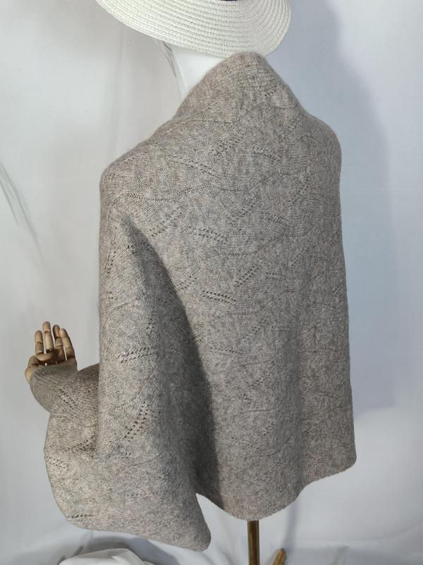 Light gray lace knit wool wrap shawl draped on mannequin, showing diamond openwork pattern and soft textured fabric - private label service available