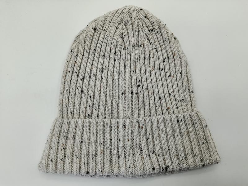 Light grey ribbed knit beanie hat with multicolor fleck tweed pattern and folded cuff, laid flat on white background - BSCI audit passed supplier