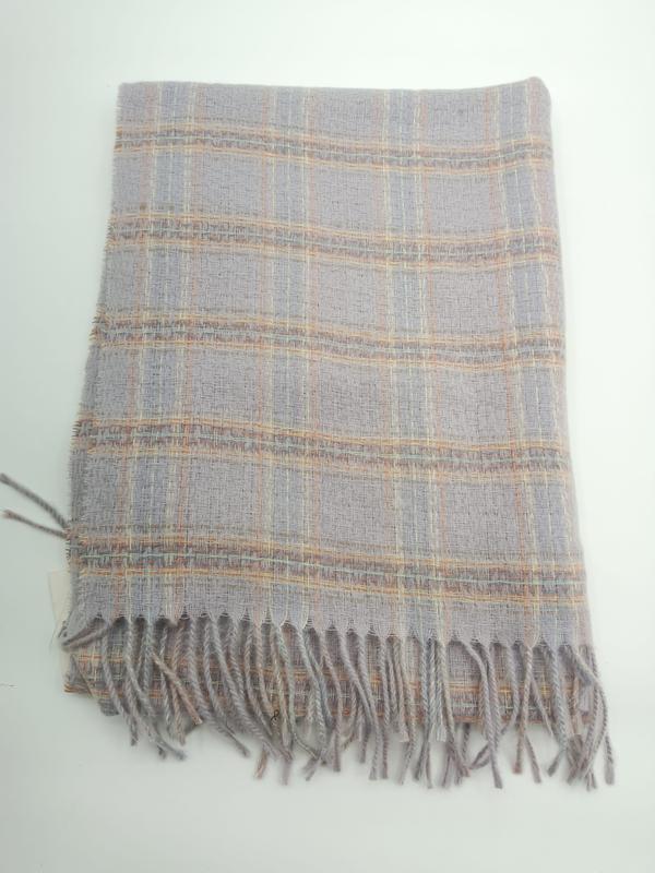 Folded light grey plaid woven throw blanket with peach and gold check pattern and twisted fringe trim - request quote reply same day
