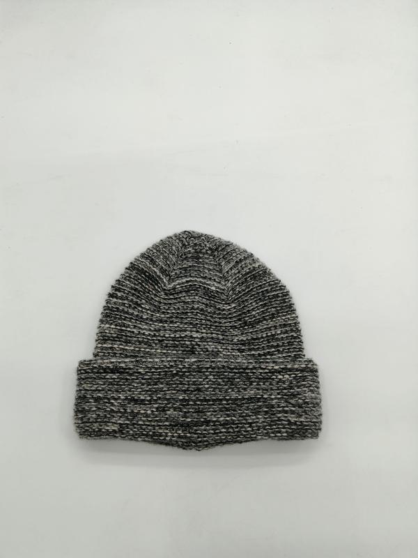 Flat lay of a grey marled chunky ribbed knit beanie hat with folded cuff on white background - sample order 10pcs available