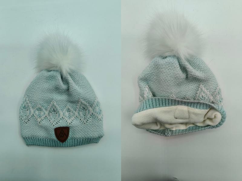 Mint green knit winter beanie with white faux fur pompom, jacquard pattern, fleece lining, and leather logo patch - air shipping 5-7 days arrival