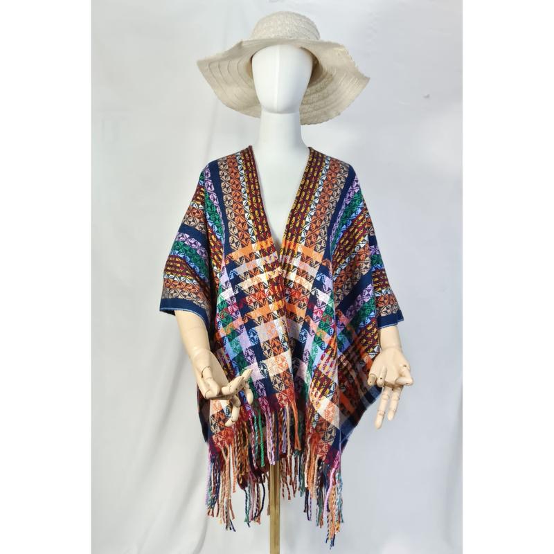 Mannequin wearing multicolor boho aztec geometric patterned fringe poncho shawl with cream floppy hat on white background - free sample within 7 days