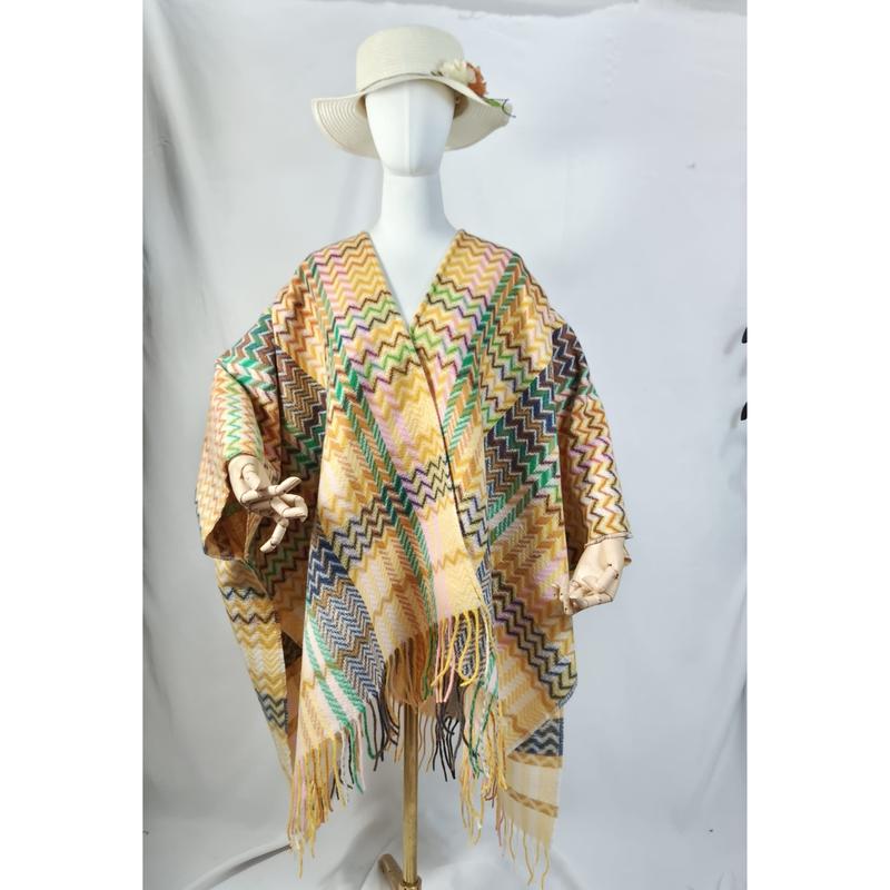 Mannequin wearing a multicolor chevron zigzag fringed poncho wrap with cream sun hat, displayed on white background - Oeko-Tex Standard 100 certified