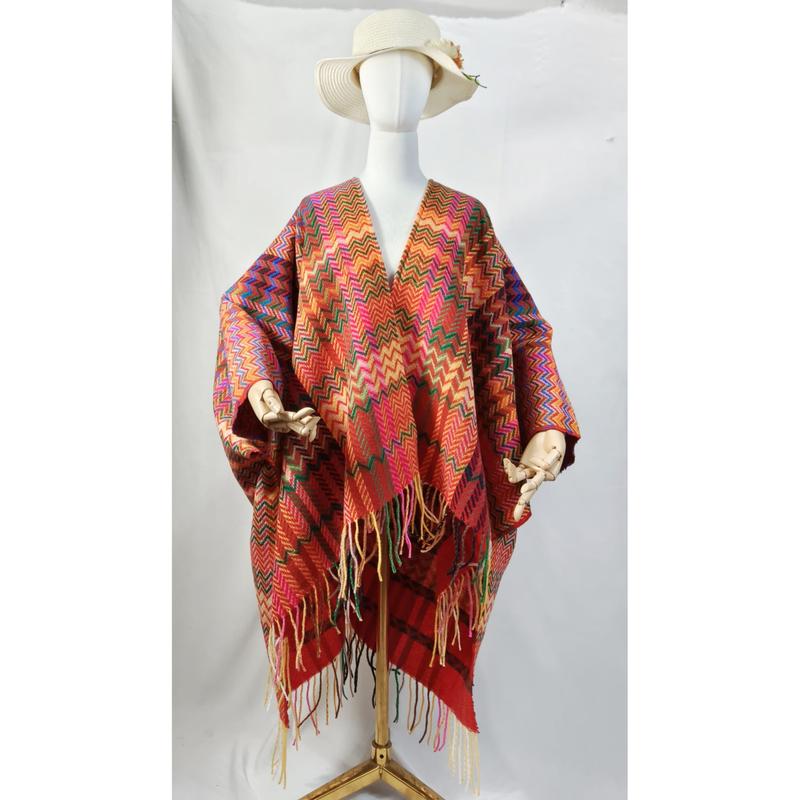 White mannequin wearing a multicolor chevron zigzag woven poncho wrap with fringe hem and wide-brim sun hat - certified scarf manufacturer China - bulk order 500+ pcs extra 8% off