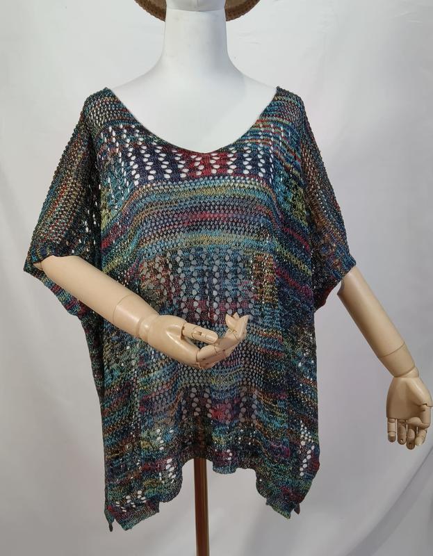 Multicolor open-knit crochet boho poncho top with short sleeves displayed on a mannequin, featuring teal, red, and gold tones - ODM OEM service available - hotel amenity scarf supplier