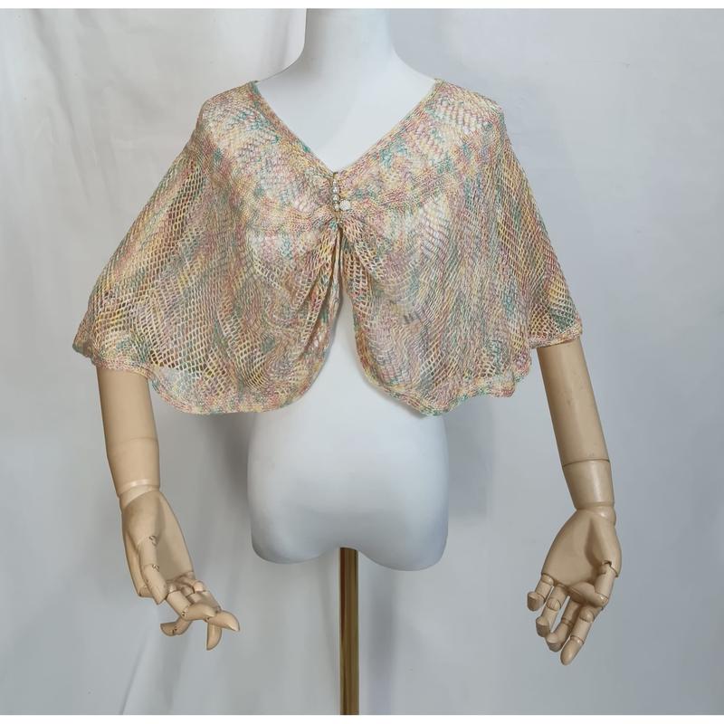 Pastel multicolor open-weave knit capelet shawl with rhinestone brooch displayed on white dress form mannequin - WhatsApp quote in 2 hours