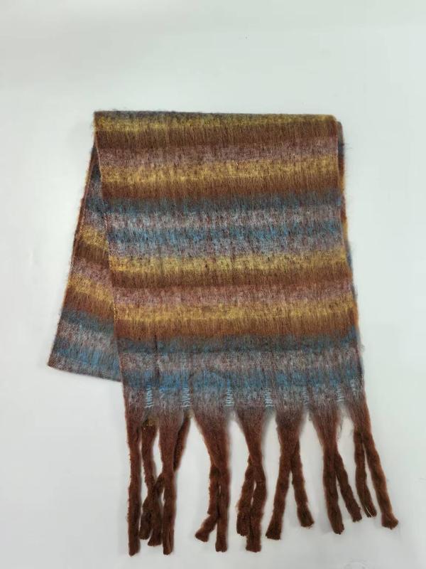 Folded fuzzy striped scarf in brown, gold, blue, and mauve with twisted fringe ends on white background - retail buyer inquiry welcome