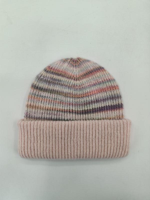 Soft knit beanie hat with multicolor pink purple grey stripes and wide ribbed cuff fold, laid flat on white background - winter accessories wholesaler