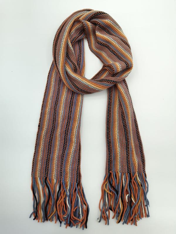 Knitted scarf with multicolor vertical stripes in rust, blue, orange, black and white, with twisted fringe ends, coiled on white background - BSCI + Oeko-Tex + GRS certified