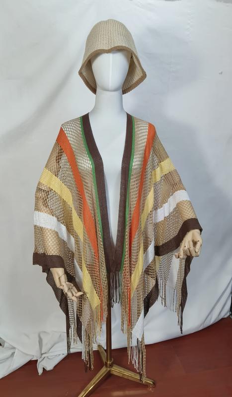 Mannequin wearing a brown orange yellow striped open mesh net poncho with long fringe and matching beige woven bucket hat - express production 15 days
