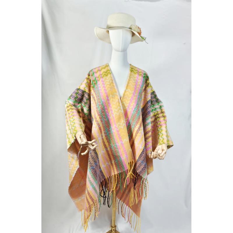 Mannequin wearing a multicolor chevron zigzag woven fringe shawl poncho with white sun hat on white background - BSCI audit passed supplier
