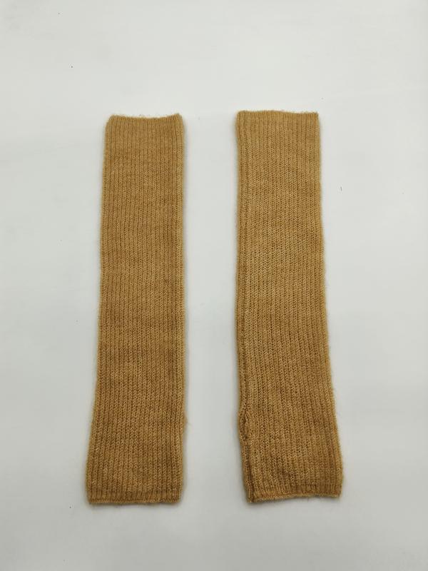 Pair of mustard yellow ribbed knit fingerless arm warmers laid flat on white background - ODM OEM service available