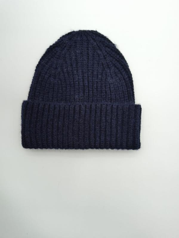 Navy blue chunky ribbed knit winter beanie hat with folded cuff, laid flat on white background - express production 15 days