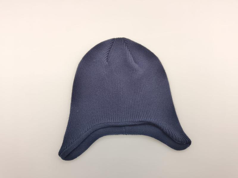 Navy blue ribbed knit winter beanie hat with ear flaps laid flat on white background - ask bulk pricing get discount